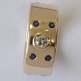 9kt yellow gold ring with flush set diamonds and sapphires 1