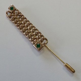 9kt yellow gold watch chain pin with flush set emeralds