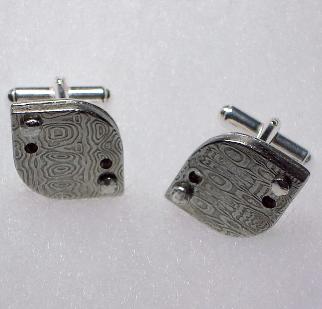 Rounded stainless damascus cuff links