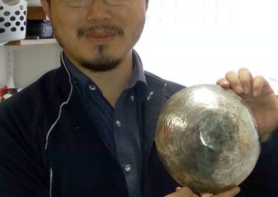 Student with his polished sterling silver rice bowl